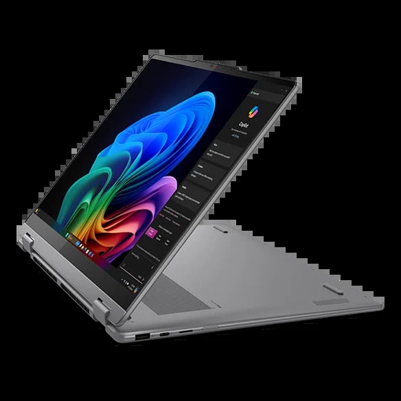 Silver convertible laptop in tent mode displaying colorful gradient abstract design on screen with control panel visible