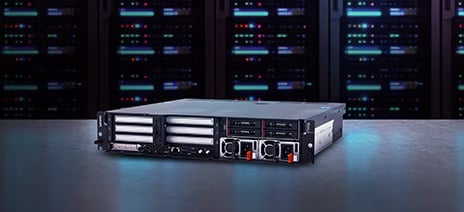 Rackmount server with dual drive bays and network ports displayed in front of server cabinet