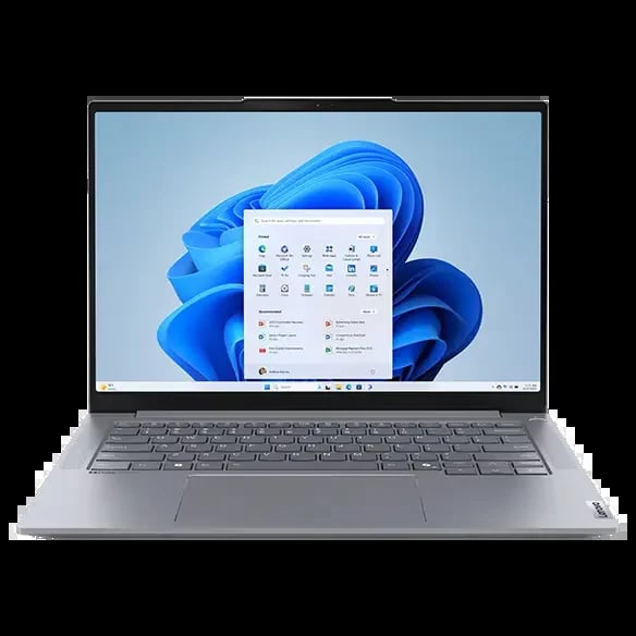 Silver laptop displaying Windows 11 start menu with blue flower wallpaper on screen