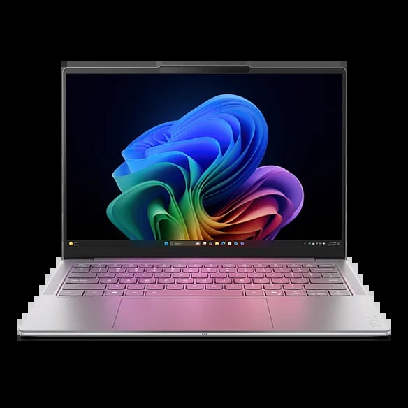 Silver laptop with pink keyboard displaying colorful blue, green, and purple swirling design wallpaper