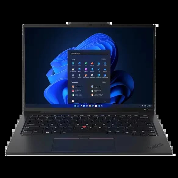 Silver laptop with colorful blue, green, and orange swirl design on display screen against black background