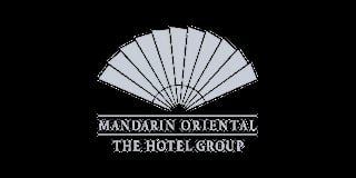Mandarin Oriental The Hotel Group logo featuring a stylized fan design on a black background