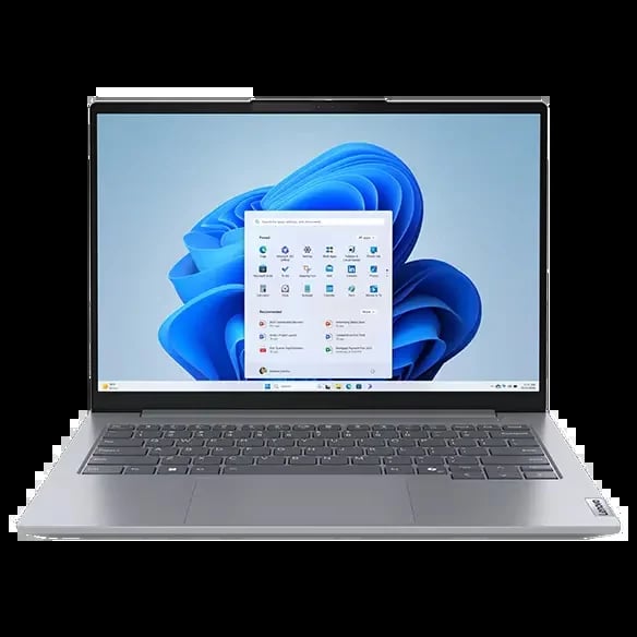 Silver laptop displaying Windows 11 start menu with blue floral wallpaper on screen