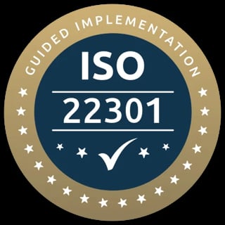 ISO 22301 Guided Implementation certification badge with checkmark and star border on dark background