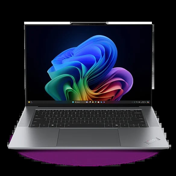 Silver laptop with colorful blue, green, orange, and purple abstract design on display screen against black background